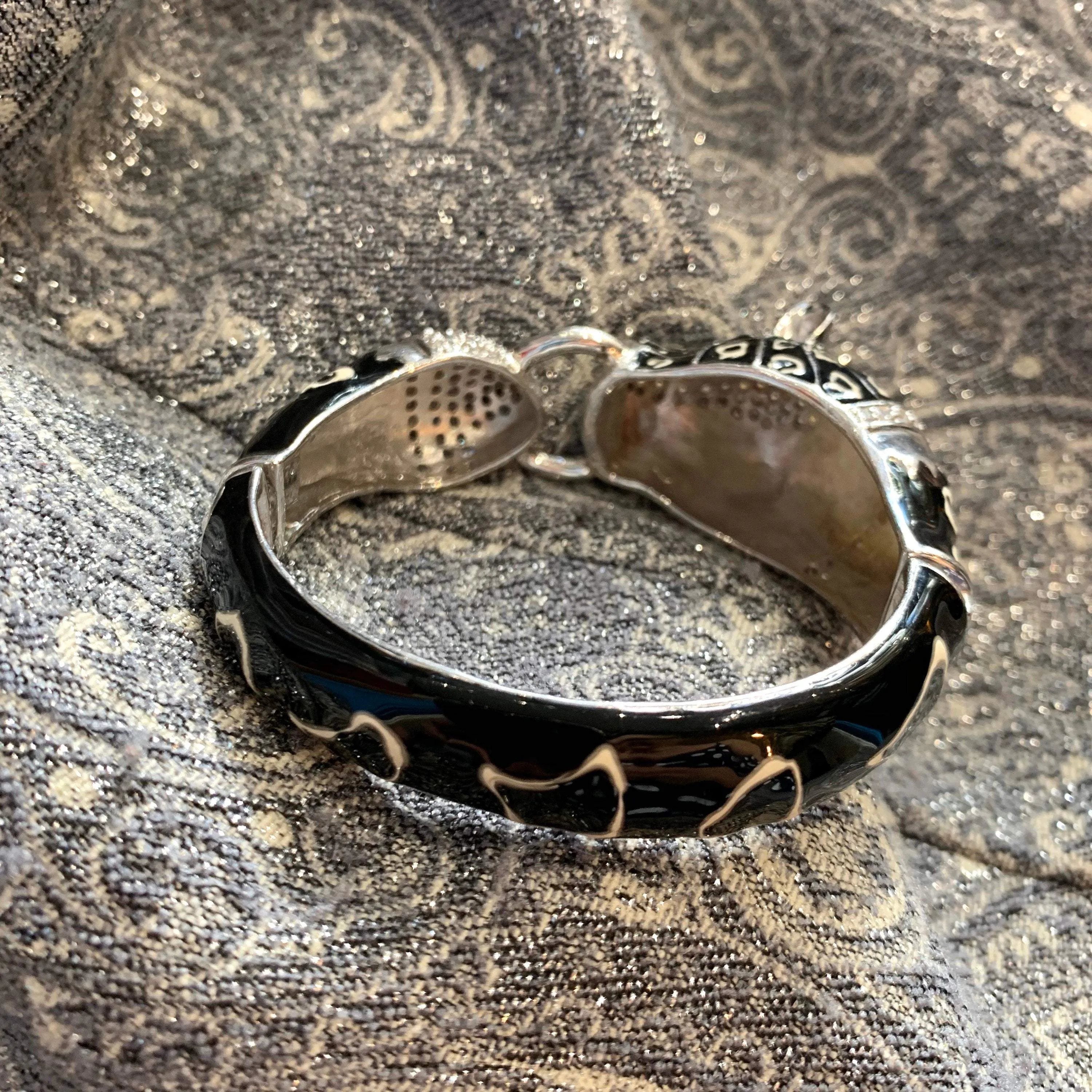 Black snow leopard cuff bracelet in silver enamel