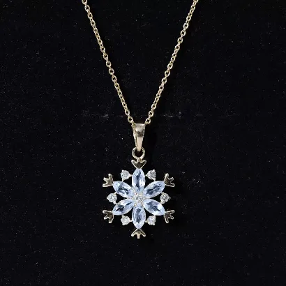 Sky Blue Topaz and Diamond Snowflake Pendant Necklace